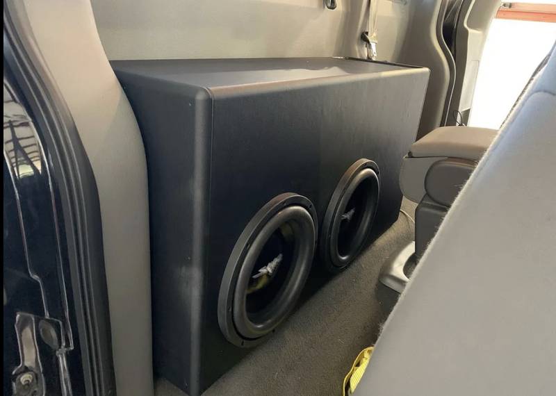 Dual subs behind truck seat